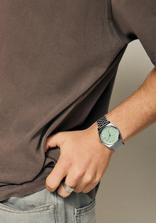 Nixon Time Teller Silver/Pistachio analog watch with stainless steel bracelet and soft pistachio green dial.