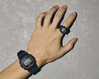 Red G-SHOCK DWN5600-4 finger-sized ring watch with digital display.