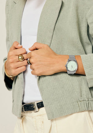 Nixon Time Teller Silver/Pistachio analog watch with stainless steel bracelet and soft pistachio green dial.