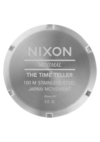 Nixon Time Teller Silver/Lavender analog watch with stainless steel bracelet and soft lavender dial.