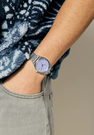 Nixon Time Teller Silver/Lavender analog watch with stainless steel bracelet and soft lavender dial.