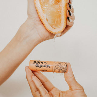 Poppy & Pout Pink Grapefruit Lip Balm, light and tart, natural hydration, eco-friendly, pink tube.
