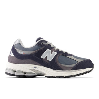 New Balance 2002R Sneakers in Eclipse with Raincloud and Graphite. These sneakers feature a retro-inspired design with a premium suede and mesh upper and a cushioned midsole for comfort.