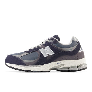 New Balance 2002R Sneakers in Eclipse with Raincloud and Graphite. These sneakers feature a retro-inspired design with a premium suede and mesh upper and a cushioned midsole for comfort.
