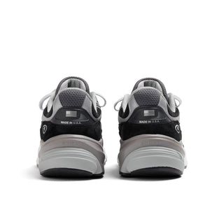 New Balance Made in USA 990v6 sneaker in black and white with pigskin suede, mesh overlays, and FuelCell cushioning.