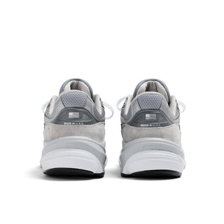 New Balance 990v6 in grey and white with pigskin suede, mesh construction, FuelCell cushioning, ENCAP midsole support.