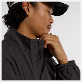 New Balance Numeric Archive Jacket in Faded Black with NB DRY moisture-wicking technology, durable ripstop fabric, 100% recycled polyester, zippered closure, and archive-inspired skate design