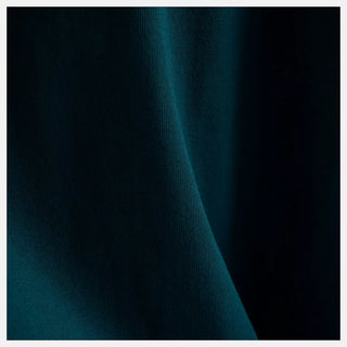 New Balance Numeric Cotton Tee in Medusa Green with 100% cotton jersey fabric, relaxed loose fit, ribbed collar, and rubberized high density branding