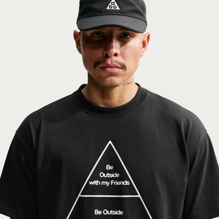Close-up of the white Be Outside with my Friends triangle graphic on the black Nike ACG Hierchy Dri-FIT Tee.