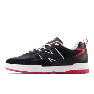 Black and red New Balance Numeric 808 sneakers, ABZORB midsole, designed by Tiago Lemos, durable and stylish.