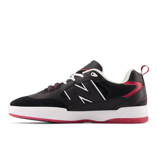 Black and red New Balance Numeric 808 sneakers, ABZORB midsole, designed by Tiago Lemos, durable and stylish.