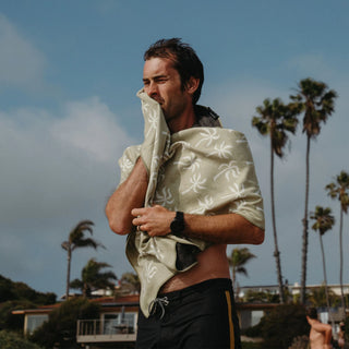 Nomadix Original Towel in Breezy Palms Olive — ultra-absorbent, quick-drying, sand and funk resistant, made from 90% recycled polyester, 72.5" x 30"