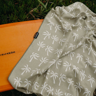 Nomadix Original Towel in Breezy Palms Olive — ultra-absorbent, quick-drying, sand and funk resistant, made from 90% recycled polyester, 72.5" x 30"