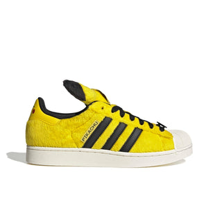 adidas Originals Pokémon Superstar II "Pikachu" in Yellow/Yellow/Core Black — yellow furry upper, Pikachu tail lace jewel, Pikachu ears on tongue, full textile lining and rubber outsole on the classic Superstar II silhouette