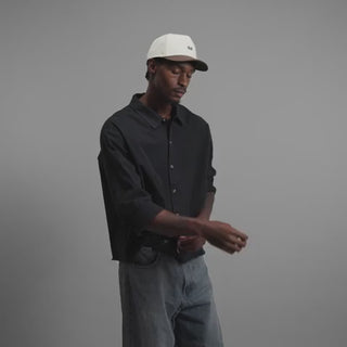 melin Odysea Rope Bulls Icon Hydro Hat in Frosted Birch with an off-white crown, brown curved visor and front logo, patterned rope trim, and perforated side panels.
