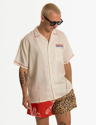 Duvin Horsin Around Swim Short in Red with playful all-over print and relaxed volley fit.