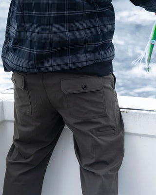 Salty Crew Transom Tech Pants Deep Forest with recycled stretch fabric, quick-dry performance, utility pockets, and adjustable drawcord waist.