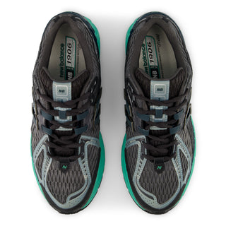 New Balance 1906RV1 sneakers in grey and green glow colorway with mesh upper, synthetic overlays, ABZORB cushioning technology, and Y2K-inspired design