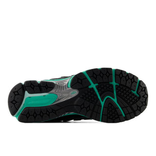 New Balance 1906RV1 sneakers in grey and green glow colorway with mesh upper, synthetic overlays, ABZORB cushioning technology, and Y2K-inspired design