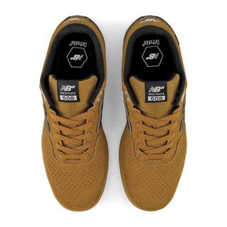 A pair of New Balance 508 Medium sneakers in a mustard brown colorway, shown from a top-down view on a white background.