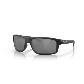 Oakley Gibston Prizm Polar Sunglasses in Matte Black with Prizm Black Polar lenses, high-wrap O Matter lightweight frame with hat compatible temple design, extended periphery, three-point fit for precise optical alignment, 11% light transmission grey base lens optimized for bright light