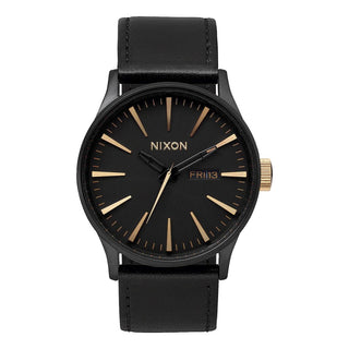 Nixon Sentry Leather Matte Black/Gold watch with black leather strap and gold-accented analog dial.