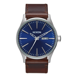 Image of the Nixon Sentry Leather Blue and Brown Watch, a classic dress watch with a blue dial and brown leather strap.