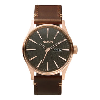 Nixon Sentry Leather Rose Gold/Gunmetal/Brown watch with brown leather strap and gunmetal analog dial.
