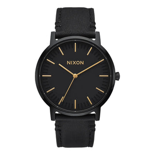 Nixon Porter Leather All Black/Gold analog watch with black leather strap and gold-accented black dial.