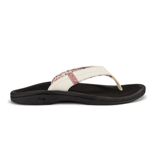 OluKai Women's 'Ohana Sandal in White Sand/Onyx — water-resistant synthetic straps, quick-drying jersey knit lining, EVA midsole with ICEVA footbed, and non-marking rubber outsole