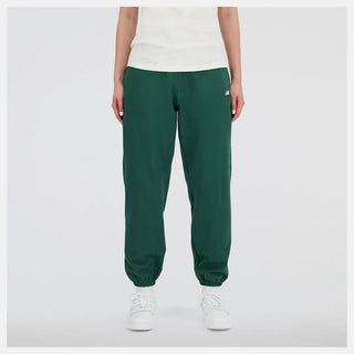 New Balance Women's French Terry Joggers in Nightwatchgreen, '90s-inspired, soft fleece.