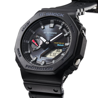 GAB2100-1A G-SHOCK watch with sleek black case and band, carbon core guard structure, Bluetooth connectivity, world time, stopwatch, and countdown timer. Shock resistant and water-resistant up to 200 meters. Elevate your style and functionality today