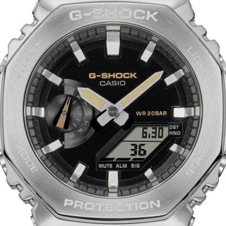 The Casio G-Shock GM-2100C-5A watch in earthy brown color, featuring shock-resistant construction, water resistance up to 200 meters, world time with 31 time zones, 4 daily alarms, 1/100 second stopwatch, countdown timer, full auto-calendar, and Super Illuminator LED light.