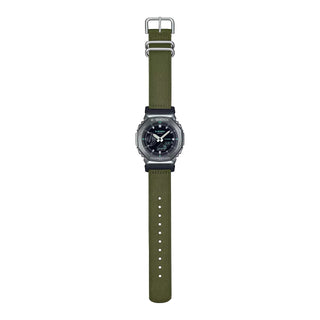 The Casio G-Shock GM-2100CB-3A watch in green camouflage pattern, featuring shock-resistant construction, 200m water resistance, world time, 4 daily alarms, 1/100 second stopwatch, countdown timer, full auto-calendar, and Super Illuminator LED light.
