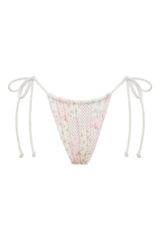 Image of Chiara bikini bottom in soft terrycloth fabric with buttons down the front, ruffled edges, and adjustable side ties, part of the Sydney Sweeney x Frankies Bikinis collaboration.
